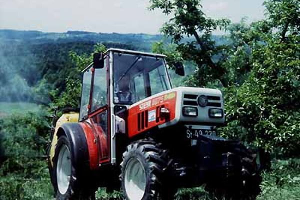Tractor with fruit tree sprayer